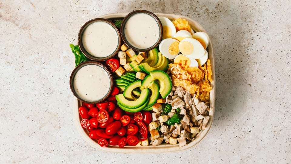 Cobb-style salad bowl with avocado and egg