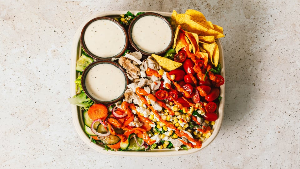 Buffalo chicken salad bowl with tortilla chips